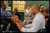 Laura Bush watches fathers play a game with their children in the R.E.A.D. to Kids Training Program at J.S. Chick Elementary School in Kansas City, Mo., Tuesday, October 11, 2005.