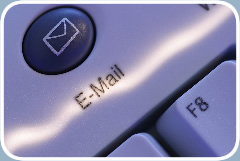 Close-up of a button labeled “E-Mail” on a computer keyboard