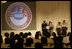 Mrs. Laura Bush is joined on stage by Ballou High School Marching Band Director Darrell Watson, left, band members Lewis Franklin, Rhia Hardman and Kenneth Horne, right, as she addresses students and guests at the White House Thursday, Oct. 11, 2007, prior to a screening of Ballou: A Documentary Film, about the Washington, D.C. band’s inspiring accomplishments. Mrs. Bush said, “Mr. Darrell Watson epitomizes the core message of the Helping America’s Youth initiative-that caring adults can have a powerful impact on the lives of our nation’s youth.”