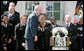 President George W. Bush poses for a photo with members of the U. S. Naval Academy football team and the Commander-In-Chief trophy he presented to the team in ceremonies in the Rose Garden at the White House, Monday, April 2, 2007. White House photo by Joyce Boghosian