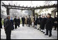 President George W. Bush stands with President Hamid Karzai of Afghanistan as he prepares to depart Kabul Monday, Dec. 15, 2008, for Washington, D.C. The President arrived in Afghanistan in the pre-dawn hours to deliver farewell remarks to the troops at Bagram Air Base and to meet with President Karzai. White House photo by Eric Draper