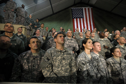 Troops at Bagram Air Base listen to remarks by President George W. Bush early Monday, Dec. 15, 2008, after his arrival in Afghanistan. The President told his audience, "I am confident we will succeed in Afghanistan because our cause is just, our coalition and Afghan partners are determined; and I am confident because I believe freedom is a gift of an Almighty to every man, woman, and child on the face of the Earth. Above all, I know the strength and character of you all. As I conclude this final trip, I have a message to you, and to all who serve our country: Thanks for making the noble choice to serve and protect your fellow Americans." White House photo by Eric Draper