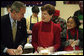 President George W. Bush talks with volunteer Connie Jeremiah as he helps pack sandwiches Dec. 20, 2001, at Martha's Table, center for homeless adults and children in Washington, D.C. White House photo by Eric Draper