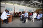 President George W. Bush and Mrs. Laura Bush join children and their families in the pediatric outpatient clinic Monday, Feb. 18, 2008, at the Meru District Hospital in Arusha, Tanzania. White House photo by Eric Draper