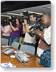 Media personnel filming press conference