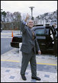 President George W. Bush gives a thumbs-up as he prepares to depart the National Counterterrorism Center Monday, Dec. 8, 2008, in McLean, Va., following his briefing and tour at the facility. White House photo by Eric Draper