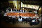 President George W. Bush meets for lunch with the Secretary of Defense, Defense Policy and Programs Team and Secretary of State and Foreign Policy Team Tuesday, Aug. 7, 2007, at Camp David. Of those photographed, Vice President Dick Cheney is seated at the President's right, Defense Secretary Robert Gates and State Secretary Condoleezza Rice are seated in front of the President. White House photo by Eric Draper