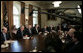 President George W. Bush, flanked by Treasury Secretary John Snow and Defense Secretary Donald Rumsfeld, addresses members of the Cabinet Monday, Jan. 30, 2006, in the Cabinet Room of the White House. White House photo by Kimberlee Hewitt