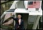 President George W. Bush waves as he departs for Camp David from the South Lawn Friday, April 4, 2003.  White House photo by Paul Morse