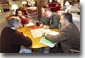 President George W. Bush receives a briefing during a meeting with CIA Director George Tenent, right, National Security Advisor Condoleezza Rice, and Chief of Staff Andy Card at Camp David, Saturday, Sept. 29, 2001. White House photo by Eric Draper.