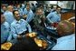 President George W. Bush shares a light moment after lunch with sailors aboard the USS Philippine Sea at Naval Station Mayport in Mayport, Fla., Thursday, Feb. 13, 2003.  White House photo by Eric Draper