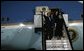 Waving to the crowd, President and Mrs. Bush and Latvia's President Vaira Vike-Freiberga deplane Air Force One Friday night, May 6, 2005, after the Bushes arrived in Riga, Latvia for the first of four European stops.  White House photo by Eric Draper