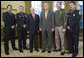 President Bush and U.S. Attorney General Michael Mukasey pose for photos with recipients of the Public Safety Officer Medal of Valor Wednesday, Dec. 12, 2007, in the Oval Office. From left are: Officer Kevin Howland of Sacramento; Officer Todd Myers of West Hartford, Conn.; Attorney General Mukasey; President Bush, Sgt. Kirk Van Orsdel of Hemet, Calif., and David Loving, a firefighter from Richmond, Va. White House photo by Chris Greenberg