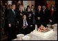 President George W. Bush wishes Sen. Strom Thurmond happy birthday during a birthday celebration at the White House Dec. 6, 2002. The South Carolina senator turned 100 years old Thursday.  White House photo by Eric Draper