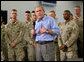 President George W. Bush speaks to Marines and their families following lunch inside the mess hall at the Marine Corps Air Ground Combat Center in Twentynine Palms, California, Sunday, April 23, 2006.  White House photo by Eric Draper