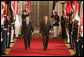 President George W. Bush walks with Dr. Ibrahim Jaafari, Prime Minister of Iraq, toward the East Room Friday, June 24, 2005, to meet the media.  White House photo by Paul Morse