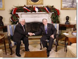 President George W. Bush welcomes President Mahmoud Abbas of the Palestinian Authority Friday, Dec. 19, 2008, to the Oval Office of the White House. White House photo by Eric Draper