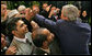 President George W. Bush reaches out to shake hands with U.S. Embassy staff and families Tuesday, Jan. 15, 2008, during his visit to Riyadh, Saudi Arabia. White House photo by Chris Greenberg