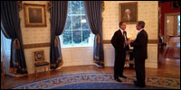 Before delivering his address to Congress and the nation following the attacks of September 11, President George W. Bush speaks with British Prime Minister Tony Blair in the Blue Room, Sept. 20, 2001.