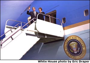 President George W. Bush and Laura Bush board Air Force One after attending a memorial service for the crew of the U.S. Space Shuttle Columbia at NASA's Lyndon B. Johnson Space Center in Houston, Texas, Tuesday, Feb. 4, 2003.