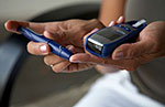 A person with diabetes testing blood sugar levels.