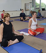 People meditating in yoga position. copyright Bob Stockfield