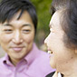 An older woman discussing health with a younger adult