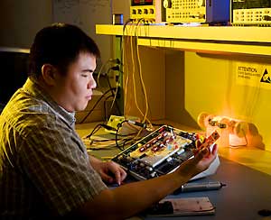 Photo of former NSEI intern at work in the lab