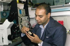 Anup Singh inspects lab materials