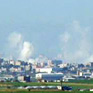 A view of Gaza, with smoke rising, seen from the Israeli side of the border