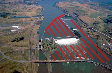 Aerial photo with line overlay marking out areas around The Dalles Dam that are part of the Boat Restricted Zone (BRZ).