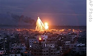 Fire and smoke are seen from Israeli military bombing in Gaza City, 08 Jan 2009