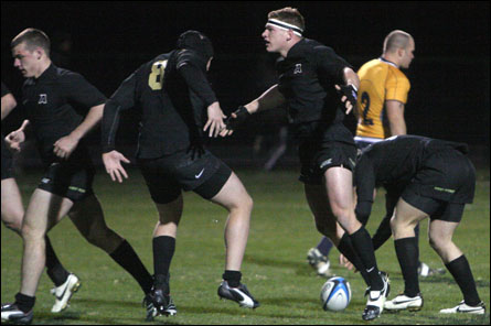 Army rugby players celebrate a first half try