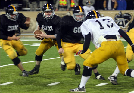 A member of the Goat football team looks to pass