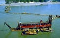 Color Photo- Dredge at work on the river