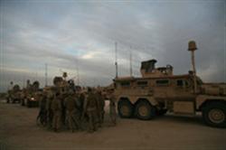 CAMP BAHARIA, Iraq (Dec. 30, 2008) – The Marines of first squad, Security Company, Combat Logistics Battalion 5, 1st Marine Logistics Group, review procedures before a combat logistics patrol Dec. 30. The Marines in Security Co. provide route security for convoys. Their defensive tactics keep the other vehicles out of harm’s way and ensure a safe trip to their destination. They protect the convoy and are responsible for setting up landing zones in case a casualty needs to be evacuated. (Photo by Cpl. Tyler B. Barstow)