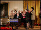 President George W. Bush is applauded by Mrs. Laura Bush, Cabinet members and members of Congress, at the proclamation signing for Women's History Month Monday, March 10, 2008 in the East Room of the White House in honor of Women's History Month and International Women's Day. From left are, U.S. Secretary of Labor Elaine Chao, U.S. Secretary of Transportation Mary Peters; New York Rep. Carolyn Mahoney, Rep. Marsha Blackburn of Tennessee, Rep. Judy Biggert of Illinois, Rep. Mary Fallin of Oklahoma, Rep. Shelley Moore Capito of West Virginia, Rep. Dianne Watson of California and Rep. Jean Schmidt of Ohio. White House photo by Joyce N. Boghosian