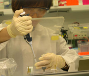 Photo of researcher with pipette.