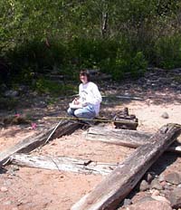 (NPS photo) Archeologist notes feature at Apostle Islands National Lakeshore