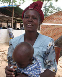 Photo of Nyasa Tunga with her youngest son who was treated and cured of malaria.