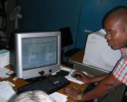 Photo Alfredo Bia consulting antimalarials stock levels on the SIGM.  The SIGM is a computerized drug management system that is funded by USAID and developed by DELIVER and SCMS for the Mozambican MOH.