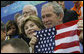 President George W. Bush and Mrs. Laura Bush cheer on the U.S. Olympic swimmers during the Sunday morning competition at the National Aquatics Center in Beijing. White House photo by Eric Draper