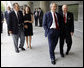 President George W. Bush is greeted by U.S. Ambassador Sandy Randt upon his arrival Friday, Aug. 8, 2008, at the U.S. Embassy in Beijing. With them at left are former President George H.W. Bush and Ms. Barbara Bush. White House photo by Eric Draper