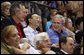 President George W. Bush attends the U.S. Olympic Men's Basketball Team's game against China with his father, former President George H.W. Bush and China's Foreign Minster Yang Jiechi Sunday, Aug. 10, 2008, at the 2008 Summer Olympic Games in Beijing. White House photo by Eric Draper