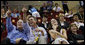 President George W. Bush is joined by his brother, Marvin Bush, daughter, Ms. Barbara Bush and Mrs. Laura Bush as they attend the U.S. Women's Olympic Basketball Team's match Saturday, Aug. 9, 2008, against the Czech Republic team at the Beijing 2008 Summer Olympics Games. White House photo by Eric Draper