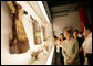 Mrs. Laura Bush closely examines a display at the Exhibition of Imperial Garments and Jewelry Saturday, Aug. 9, 2008, during her tour of the Forbidden City in Beijing. White House photo by Shealah Craighead