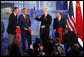 U.S. Ambassador to China Sandy Randt gives a thumbs-up to President George W. Bush and former President George H.W. Bush after they cut the ceremonial ribbon during a dedication Friday, Aug. 8, 2008, for the U.S. Embassy in Beijing. At right is Dai Bingguo, State Councilor, People’s Republic of China. White House photo by Shealah Craighead