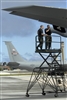 Senior Airman David Engelhardt and Master Sgt. Brian Dickerson change a KC-135R Stratotanker's boom marker light.
