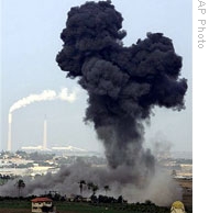 Seen from the southern Israeli city of Ashkelon (in the background), an Israeli missile strikes northern Gaza, 29 Dec 2008