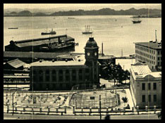 View of boats in a harbor with buildings in the foreground.